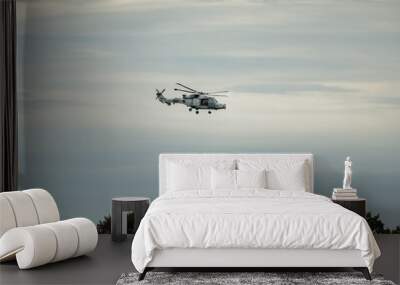 British army wildcat helicopter flying low on exercise Wall mural