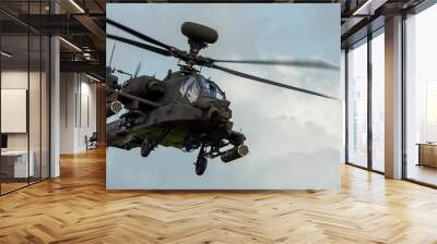 close-up front quarter view of ZM707 British army Boeing Apache Attack helicopter gunship (AH64E AH-64E ArmyAir606) in low level flight  Wall mural