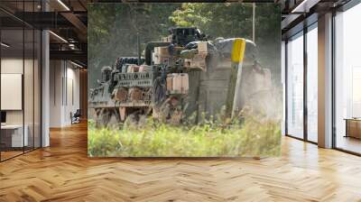 heavily laden USA Stryker 8-wheeled fighting vehicle in motion Wall mural