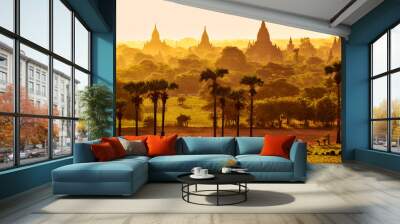 Colorful bright sunrise in with temples, fields and working cattle, Bagan Wall mural