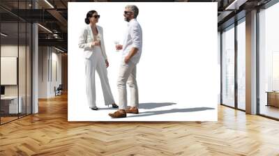 Man and woman in elegant white clothing standing and drinking cocktails and talking isolated on white background Wall mural