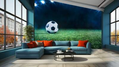 Football or soccer ball background with spotlights Wall mural