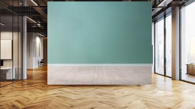 Light blue textured wall and wooden floor in empty room for displaying your product, light coming through window. Wall mural