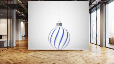 Matt white Christmas ball decorated with twisted royal blue stripes. Wall mural