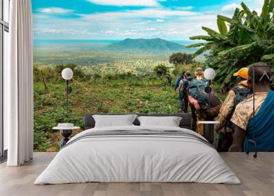 Scenic view of a group of hikers against a Mountain background at Mount Napak in Karamoja, Uganda
 Wall mural