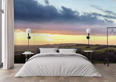 scenic Westerly view over as the golden sun sets over Oare and across the Pewsey Vale valley Wall mural