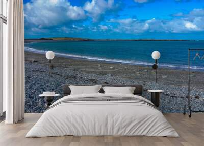 the conwy bay beach curving around toward a blue cloud sky Wall mural