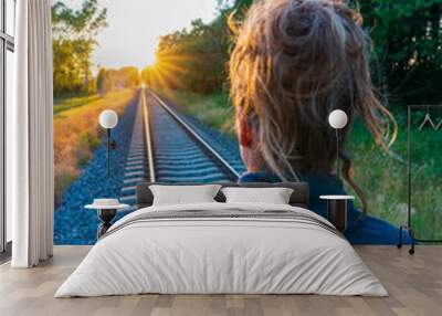 The train tracks and the sun's rays are falling beautifully. Wall mural