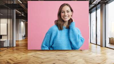 Portrait for beautiful smiling woman on a pink background, colorful portrait Wall mural