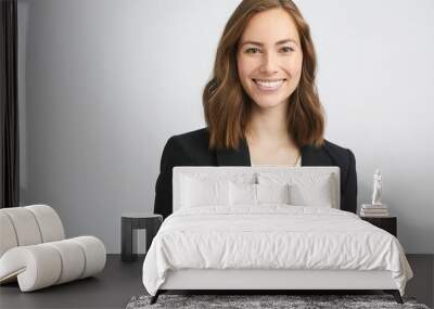 Portrait of a beautiful young business woman smiling and looking gorgeous while looking in camera, isolated on white background Wall mural