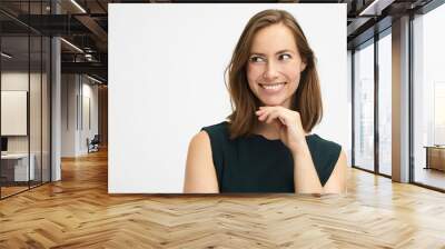 portrait of a cute young woman looking to the left while being thoughtful and smiling Wall mural