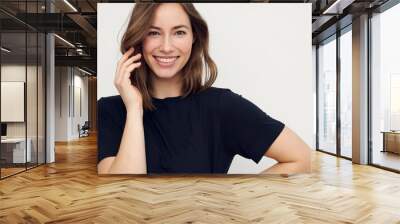 Portrait of a happy smiling brunette woman looking beautiful standing isolated on white background. Young female girl with a perfect smile.	 Wall mural