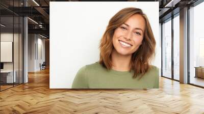 portrait of a young happy woman smiling on white background Wall mural