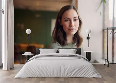 Portrait of Beautyful young woman is sitting on a café Wall mural