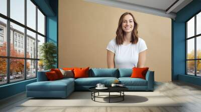 Portrait of happy smiling girl on a modern color background Wall mural