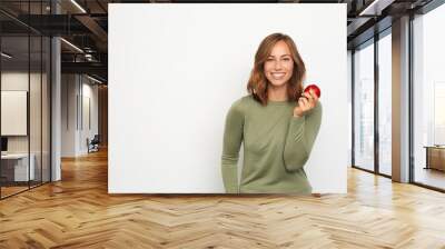 portrait of happy young woman with red apple Wall mural