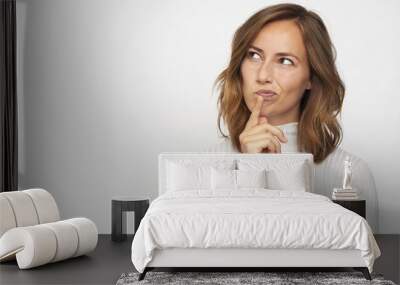 portrait of young woman thinking looks left Wall mural