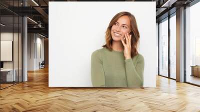 young smiling woman talking on the phone Wall mural