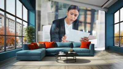 Business woman, tablet and typing in a office with web designer working on ui information. Internet research, young female worker and thinking of a employee on a app for digital project and work Wall mural