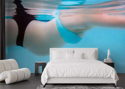 pregnant woman with baby belly swimming Wall mural