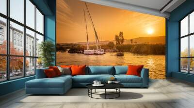 Sailboats on the river Nile at sunset in Egypt Wall mural