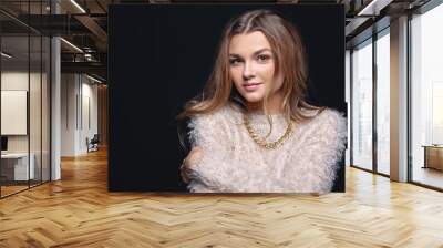 Portrait of a beautiful young woman in a stylish sweater Wall mural