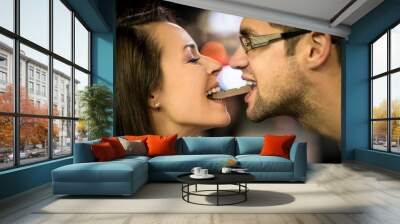 Couple eating chocolate on date Wall mural