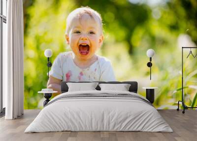 Happy baby with strawberry Wall mural