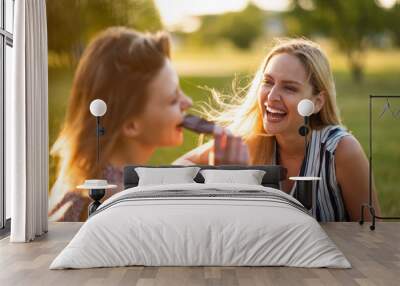 Women having chocolate bursting out in laughter Wall mural