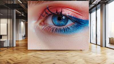 Closeup view of woman eyes with amazing bright eye makeup in luxurious blue shades. Pink and blue color, colored eyeshadow Wall mural