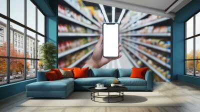 Man use mobile phone with blank screen, blurred supermarket in background.	 Wall mural