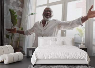 positive elderly black man dancing in his house. symbolizing joy and happiness, a wellbeing concept Wall mural