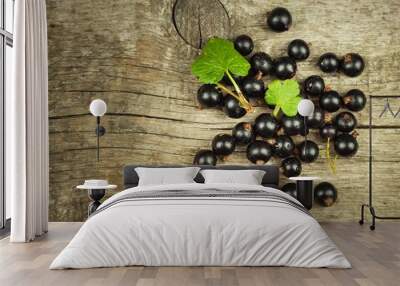 Fresh black currant on a wooden table. Healthy fruit, full of vitamins and antioxidants. Healthy food. Wall mural