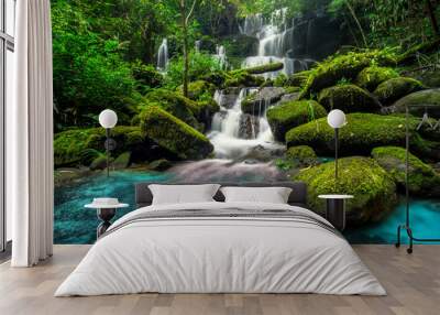 beautiful waterfall in green forest in jungle Wall mural