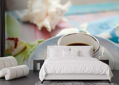 Cup of espresso set with an orchid flower and seashells Wall mural