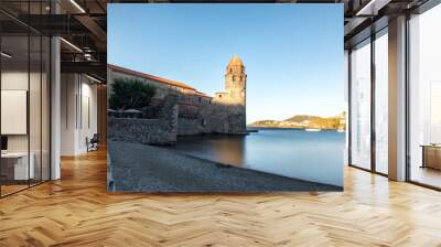 Beautiful autumn day in the tourist city of Colliure in Occitania whit on back the church of Notre dames des Anges, France. Wall mural