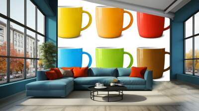 Set of ceramic mugs painted in different colors isolated on an empty background Wall mural