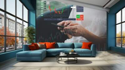 A businessman or trader is pointing to a growing stock of virtual holograms. invest in trading Planning, Analysis, Indicators and Buying and Selling Strategies, Stock Market Wall mural