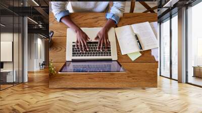 African American female entrepreneur working online at her table Wall mural