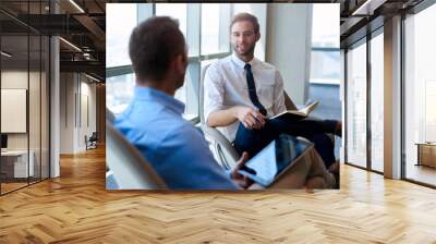 Business coworkers having a positive conversation in modern office Wall mural