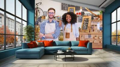 Two diverse young baristas working together in a trendy cafe Wall mural