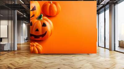 halloween pumpkins on an orange background a symbol of a scary night Wall mural