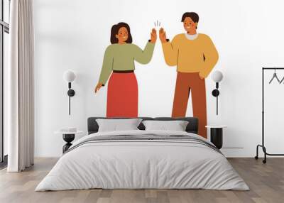 Man and woman give to each other high five as sign of good unity work. Business people do greeting gesture and glap palms. Partnership and success concept. Friends or colleugues welcoming each other Wall mural