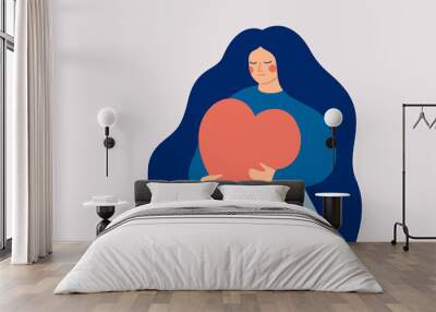 young woman embraces a big red heart with mindfulness and love. self acceptance and confidence conce Wall mural