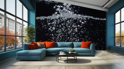 soda water bubbles splashing underwater against black background cola liquid texture that fizzing and floating up to surface like a explosion in under water for refreshing carbonate drink concept Wall mural