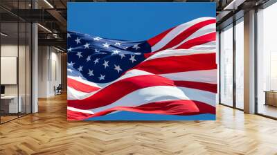 Closeup of American flag blowing in the wind with blue sky Wall mural