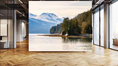 Snow-capped mountains and evergreen trees along the coast of southern Alaska Wall mural