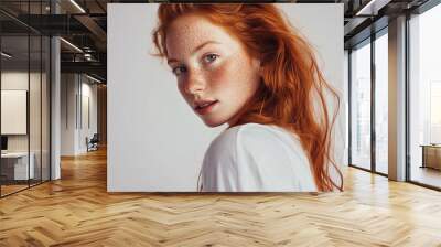 portrait of elegant pretty young woman with ginger long hair style in white clothes smiling posing on white background, pretty cute candid beauty portrait, natural look, face skin with freckles Wall mural