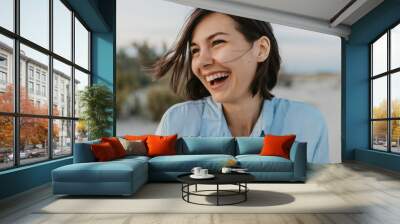 smiling portrait of candid laughing woman Wall mural