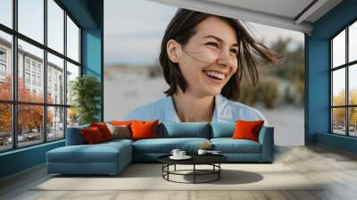 smiling portrait of candid laughing woman Wall mural